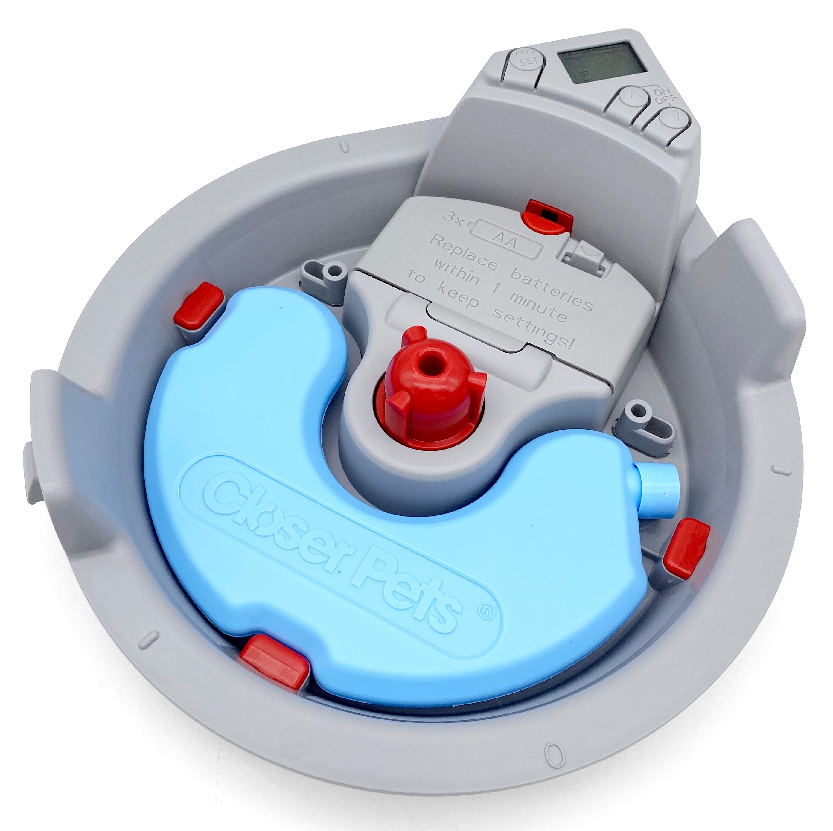 A top-down view of the grey pet feeder base with a blue reusable ice pack in it, on a white background
