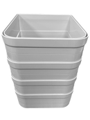A stack of four white wall liners on a clear background