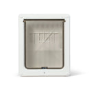 A white pet door for medium size dogs such as spaniels, which can also be used by cats, with a frosted flap with a horizontal clear panel with the 'Dog Mate' brand on it on a white background
