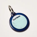 Cat Mate electronic pet ID tag in dark blue with a white and turquoise section for the owner to fill in their details on a white background