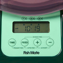 Digital timer control panel of a Fish Mate pond fish feeder with green display and purple top.