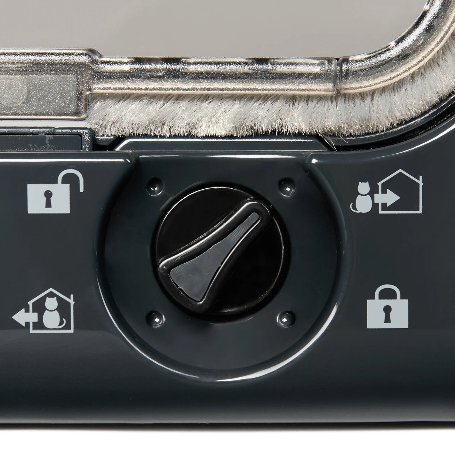 A close up view of the black control dial with white symbols showing the various manual locking options of 'inside only', 'locked', 'outside only' and 'unlocked'