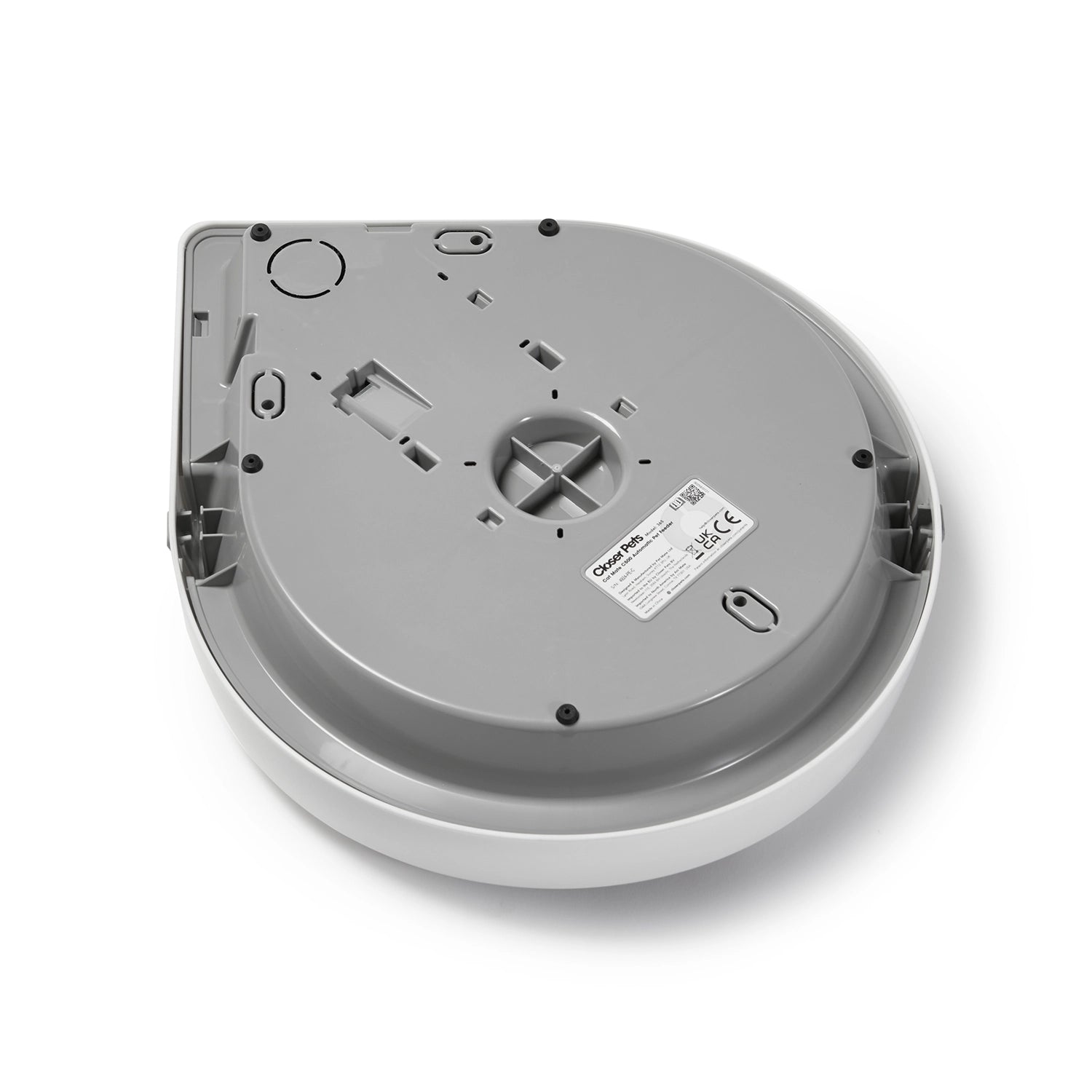 An angled view of the underside of the Cat Mate Five-meal Automatic Pet Feeder with Digital Timer (C500) in Anthracite Grey, showing the compliance label.