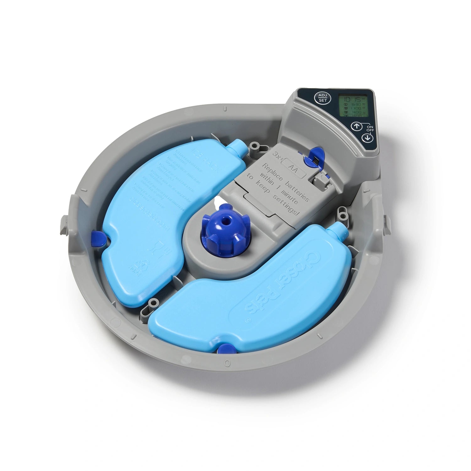 An over-head and angled photo of the inside of the Cat Mate Five-meal Automatic Pet Feeder with Digital Timer (C500) in Anthracite Grey, showing the two reusable blue ice packs, on a white background.