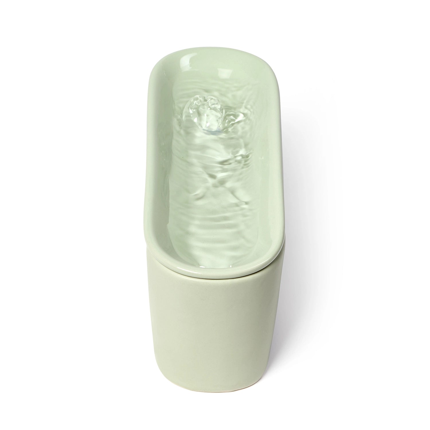 Cat Mate ceramic pet drinking fountain in sage green with flowing water in the top tier of the oval shaped device, photographed from above against a white background.