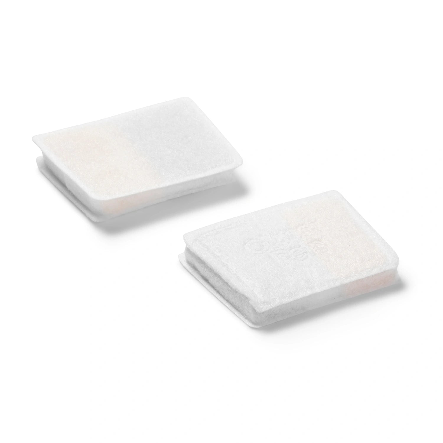 Two white, oblong, three-stage filters for the Cat Mate ceramic fountain on a white background