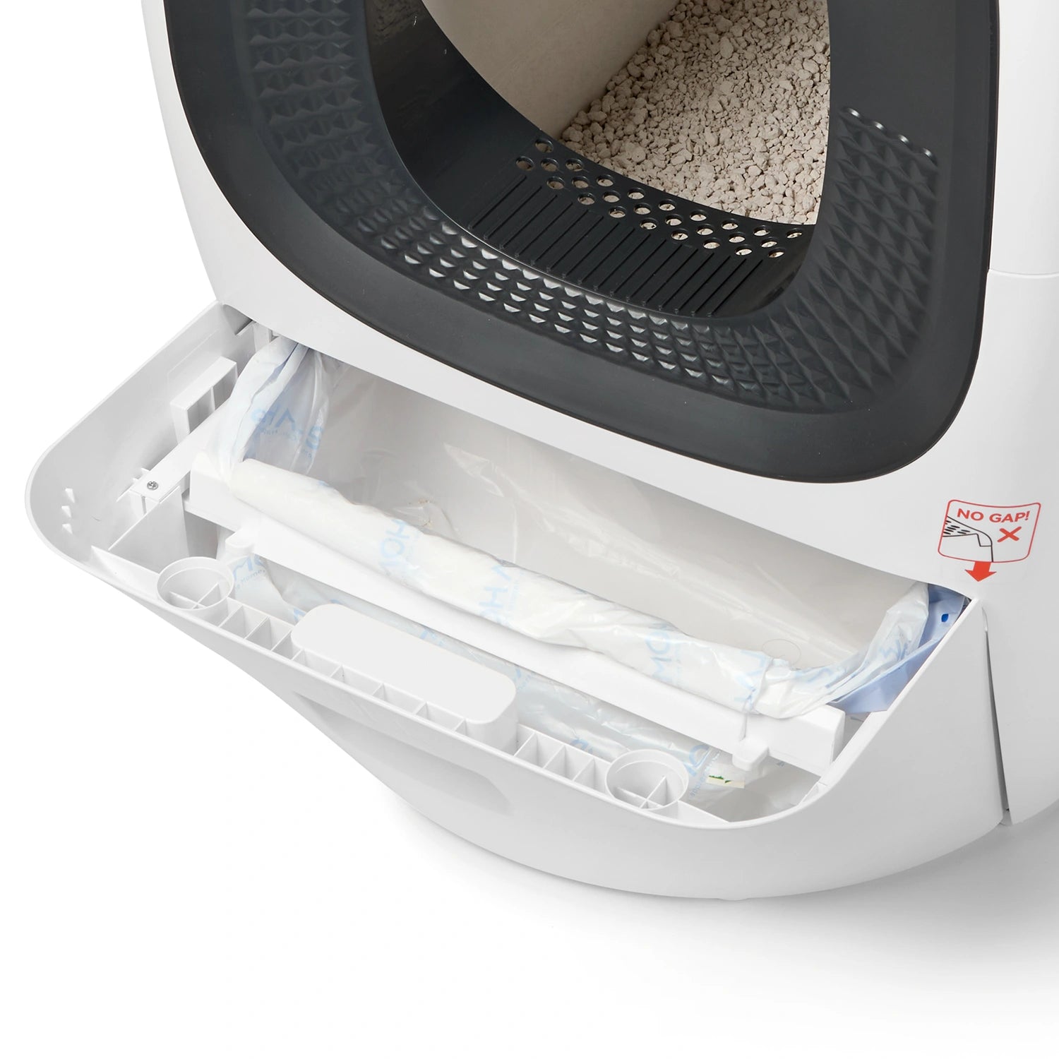 Cat Mate automatic litter box with pull-out waste drawer open, showing clear disposable liner bag ready for removal, with dark interior cavity visible above and white exterior housing