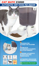 Product packaging for the Cat Mate C3000 Automatic Dry Food Pet Feeder. The image features a grey and white cat next to the feeder filled with kibble, with a wide bowl dispensing dry food. The digital control panel is visible on the front.  Text highlights include features in five languages: individual meal control, 3kg food capacity, easy-to-use LED control, dishwasher-proof components, and suitability for small to medium pets.