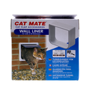 Retail packaging for Cat Mate Wall Liner. The box features a product image of a white wall liner for cat flaps, labelled 'For walls of all thicknesses.' A photo on the left shows a tabby cat exiting through a wall-mounted cat flap installed with the liner. The product is compatible with Cat Mate models 234W, 235W, 234B, and 235B. Text on the box is in multiple languages including German, French, Spanish, and Dutch. A paintbrush icon with the word 'Paintable' indicates the liner can be painted.