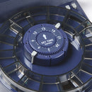 Close-up of a blue timer with dark coloured plastic feeding ring on a white background