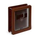 Brown plastic pet door with a transparent flap, designed for medium-sized dogs. The door features a sturdy rectangular frame with visible hinge mechanisms and a central locking panel labeled 'Dog Mate