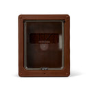 A brown pet door with a clear flap that has a two way locking mechanism with the door in the closed position on a white background 