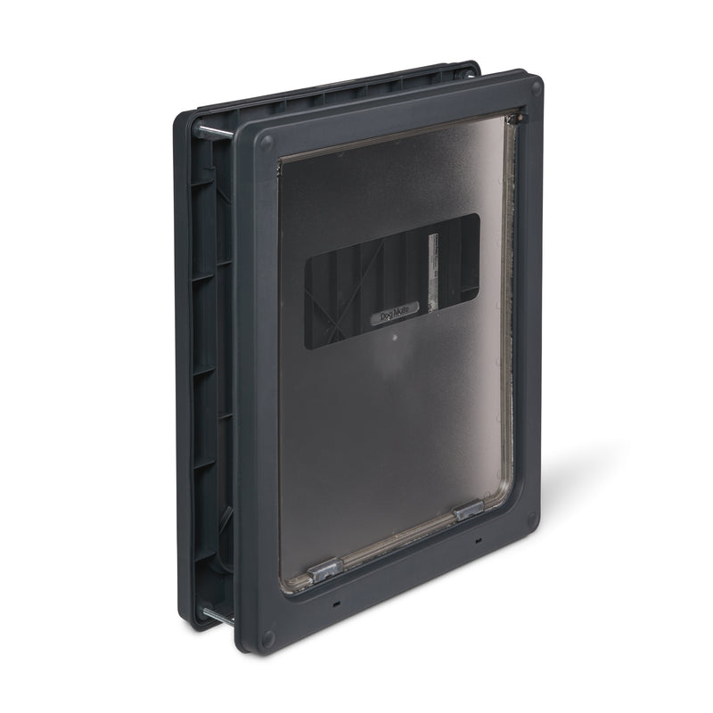 An angled view of the grey pet door made by Dog Mate for larger dogs which is self-lining up to two inches thick and has a robust locking panel 