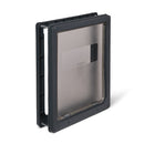 An angled view of the pet door for larger dog breeds, in grey, which is manually locked using the locking panel to control a pet's access 