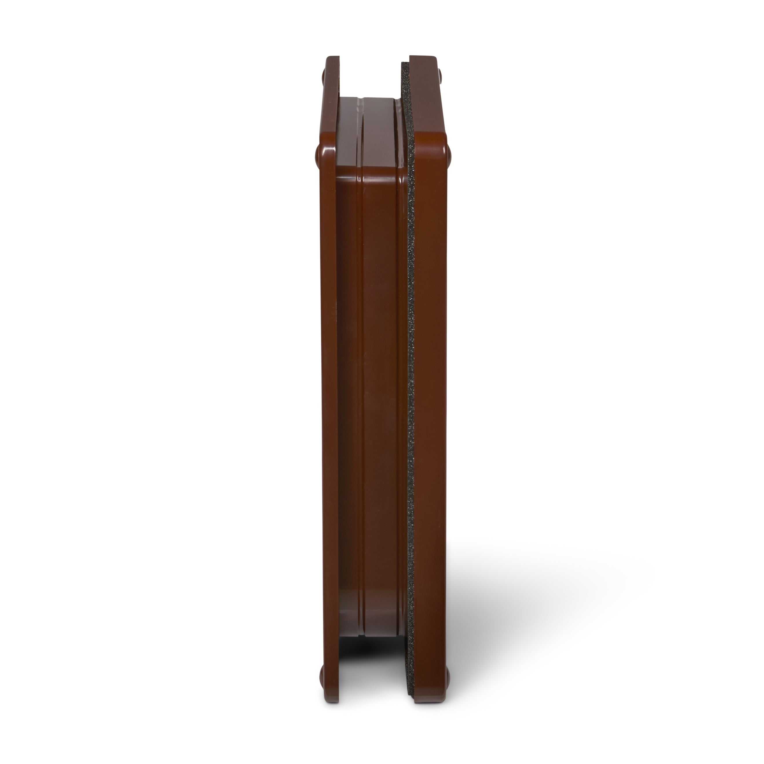 A side-on view of the brown frame for the cat door which is self-lining up to two inches and is suitable for installation into a variety of doors and thin panels, on a white background 