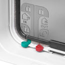 Close-up of a pet door frame in white with symbols, and red and green coloured manual locks on a white background