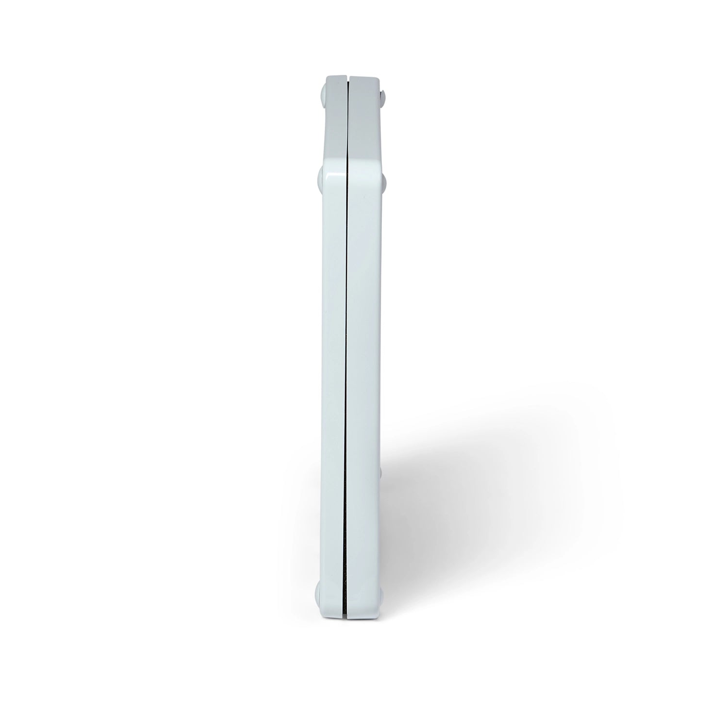 A side on view of the pet door frame in white which is self lining up to half an inch 