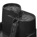 The top two tiers of the pet drinking fountain with water flowing down them on a white background 