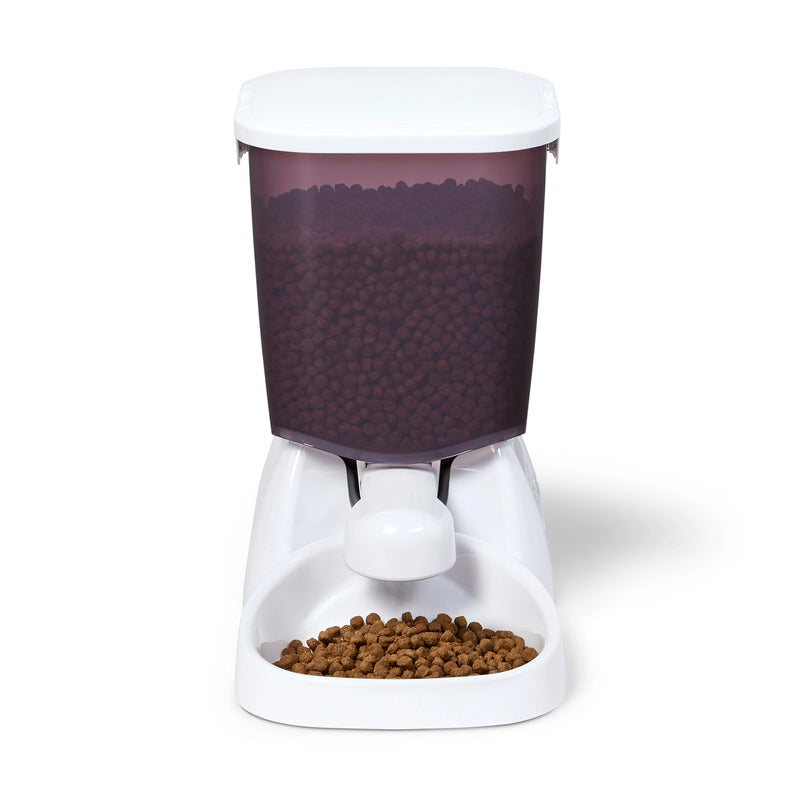 Pet food dispenser consisting of a white base and top with a purple food container with a 3kg approx capacity on a white background