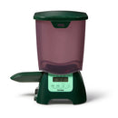 Green and purple pet feeder for pond fish with a seven litre capacity on a white background