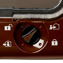 Close-up of a brown, black and white control dial on a brown cat flap with a magnetic closure with rain proof and draught proof brushing 