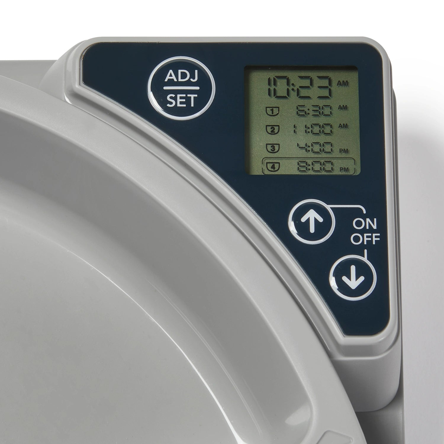 Digital control panel at the top right hand corner of the automatic pet feeder with time display and buttons.