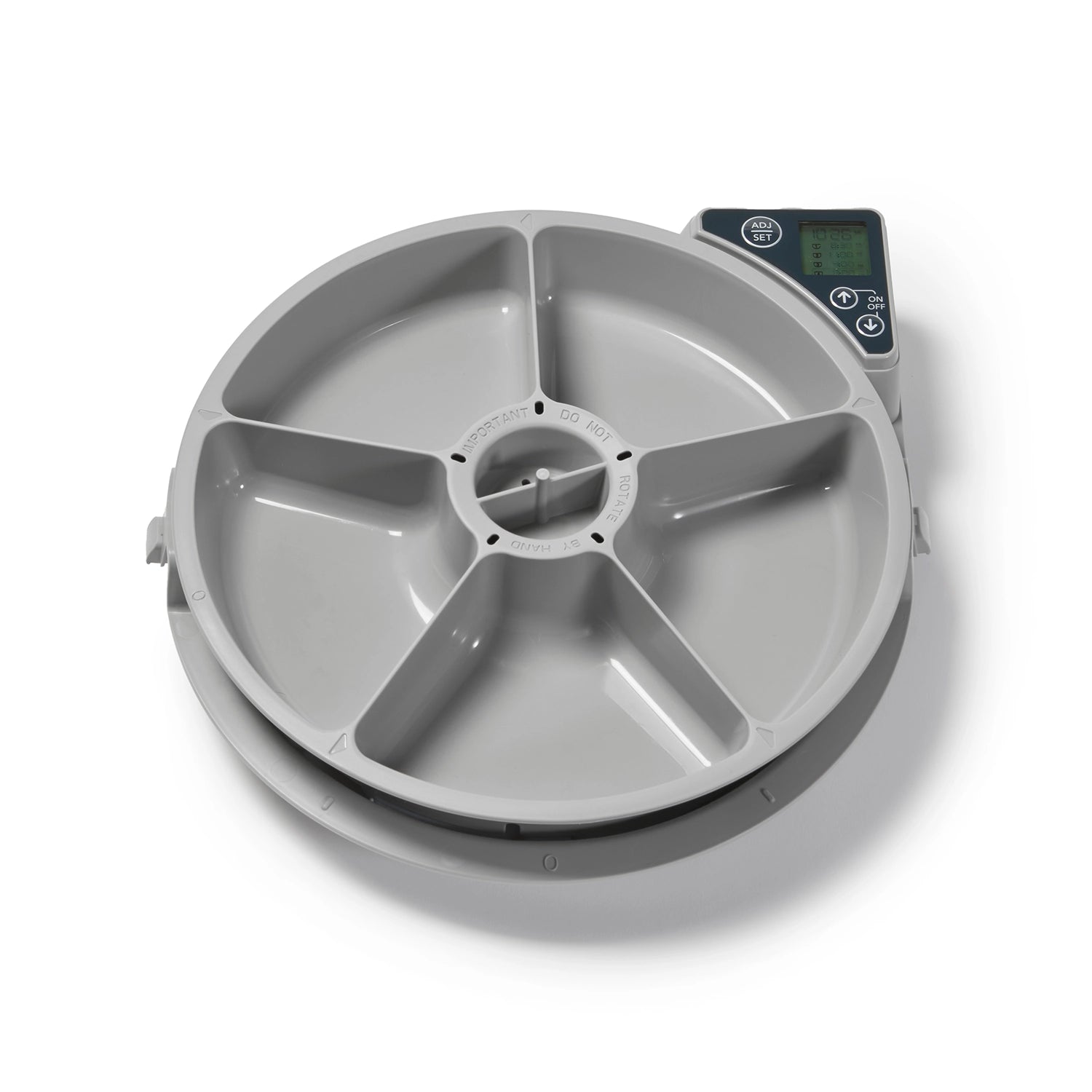An empty grey pet feeder bowl carousel on a white background 