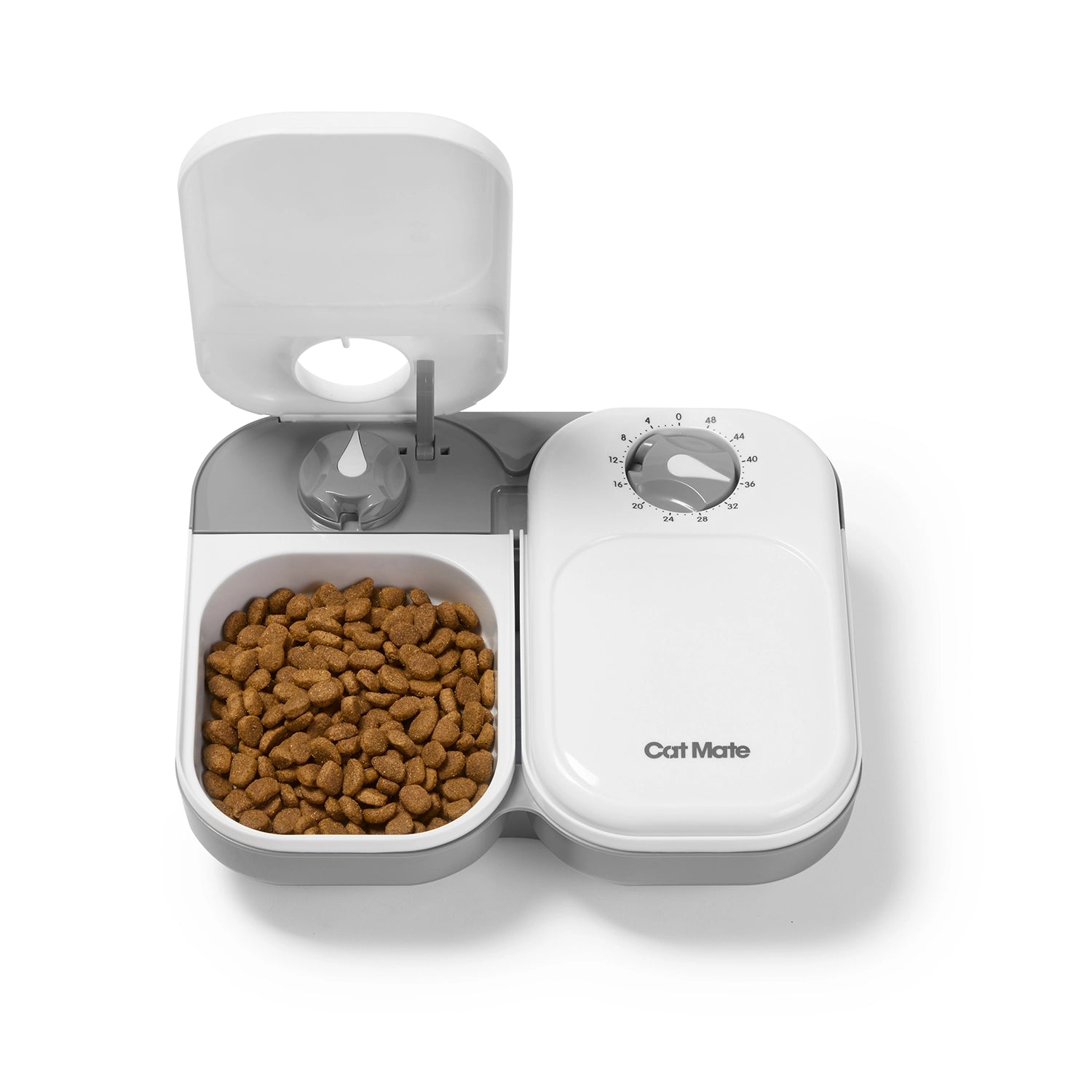 Automatic pet feeder for cats with dry cat food inside one bowl on a white background