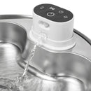 Water dispenser with water flowing out.