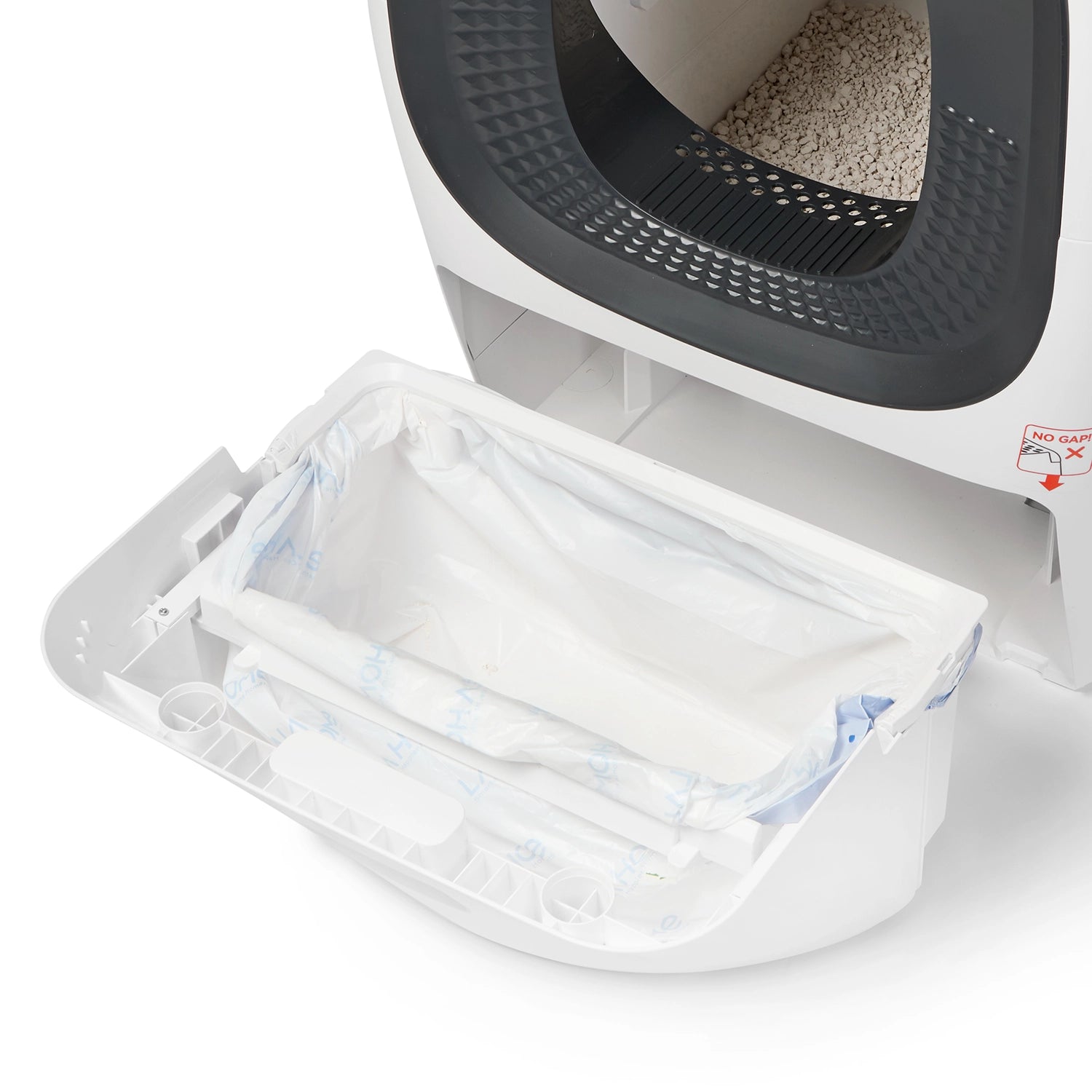 Cat Mate automatic litter box with pull-out waste drawer open, showing clear disposable liner bag ready for removal, with dark interior cavity visible above and white exterior housing