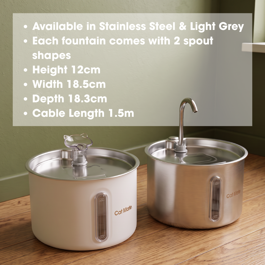 Two stainless steel Cat Mate pet drinking fountains next to each other  on a wooden surface against a green wall. One fountain is in a stainless steel colourway and the other in a light grey colourway, each showcasing the two different interchangeable spout shapes, displayed with a text overlay detailing specifications