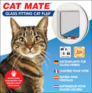 Packaging for CAT MATE Glass Fitting Cat Flap featuring a large image of a tabby cat on the left and the round white cat flap on the right. The packaging highlights features such as secure locks, unbreakable flap, weather-proof and draft-proof. It also shows the 4-way locking system with icons and a 3-year guarantee badge. Product descriptions are provided in German, French, Spanish, and Dutch.